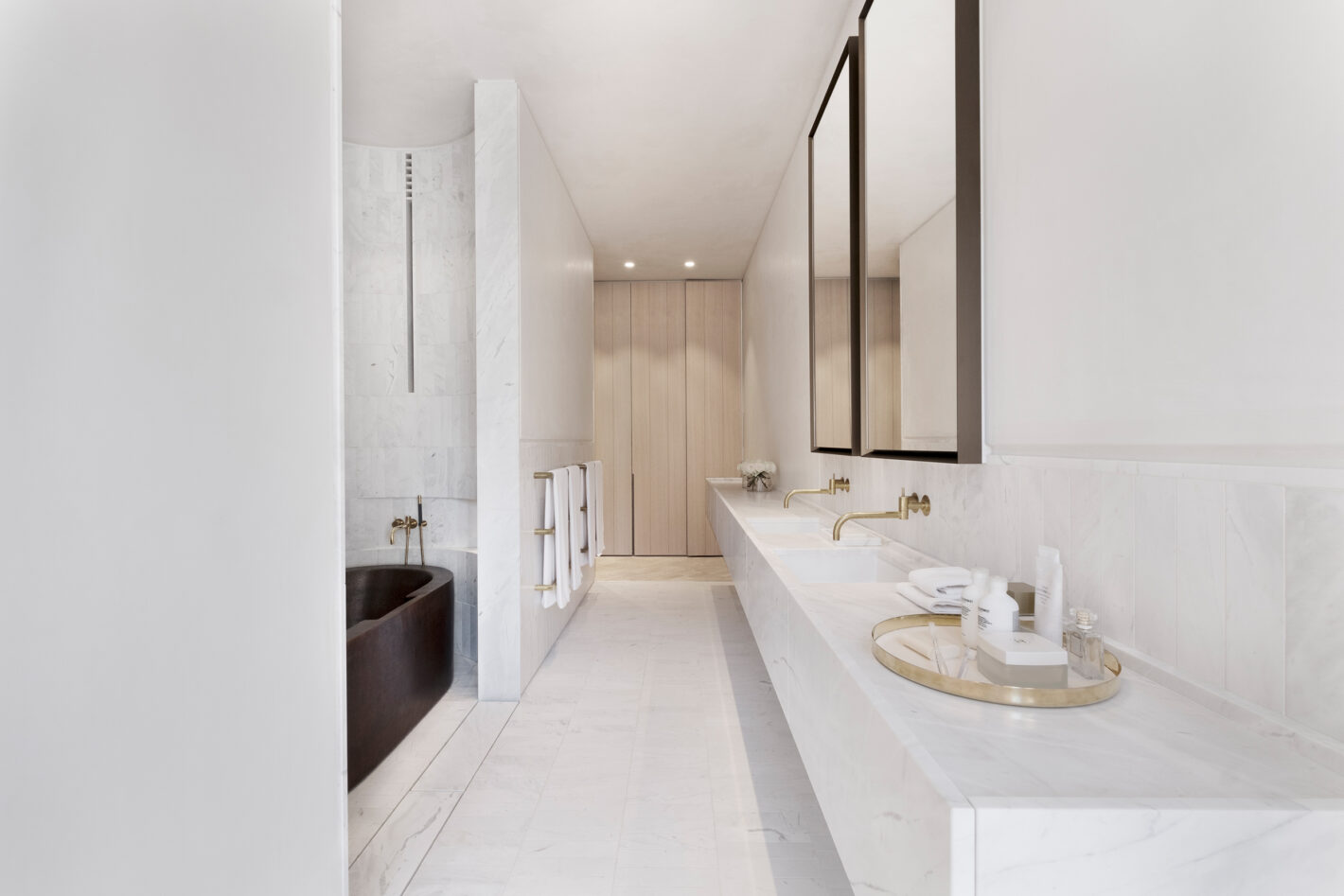 Minimalist bathroom in Indigo Slam featuring pared-back finishes and natural lighting, designed by Smart Design Studio