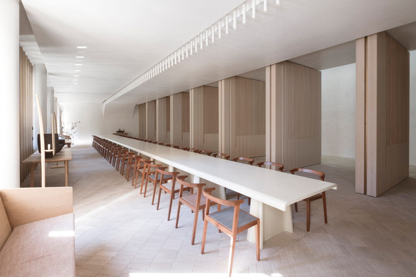Indigo Slam living room with expansive windows offering views of Central Park, Sydney, highlighting the integration of indoor and outdoor spaces.
